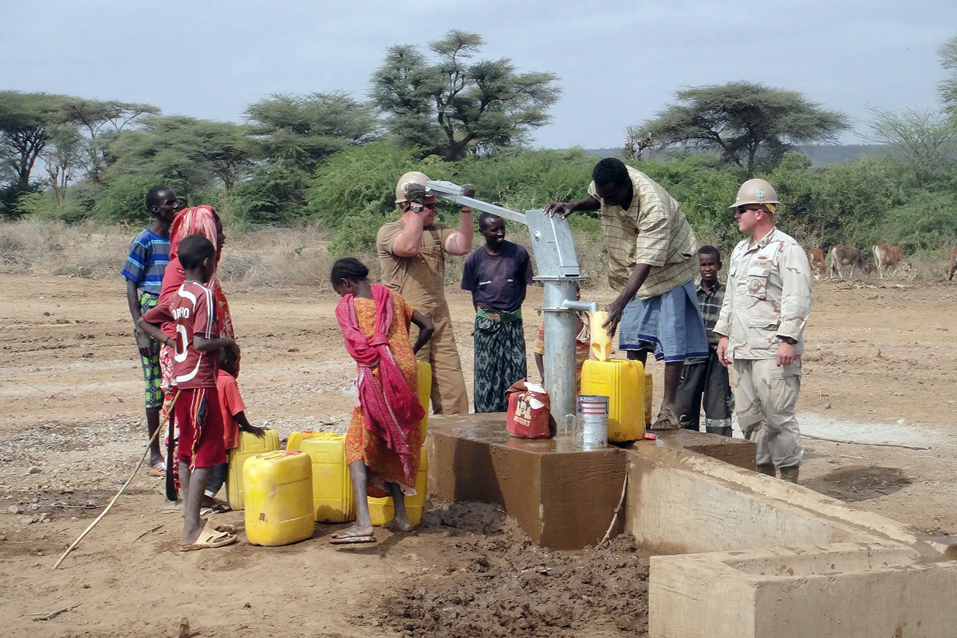 Community members gathering at a newly completed community water point