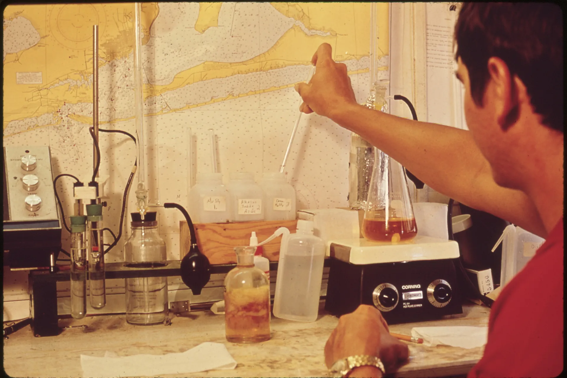 Technician analysing a water sample in a laboratory