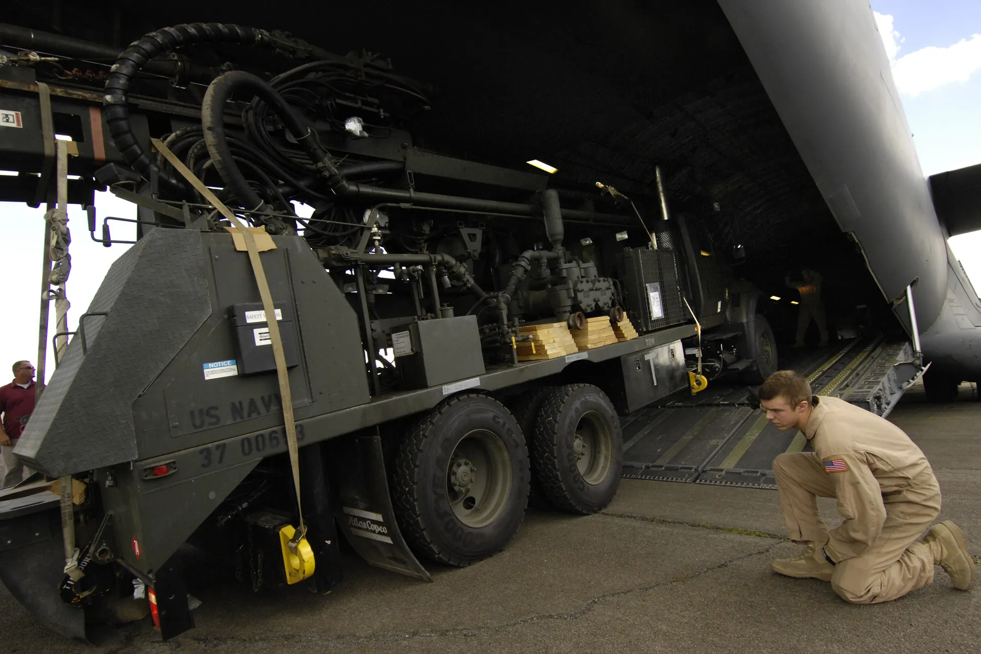 Truck-mounted borehole drilling rig deployed on a dry site